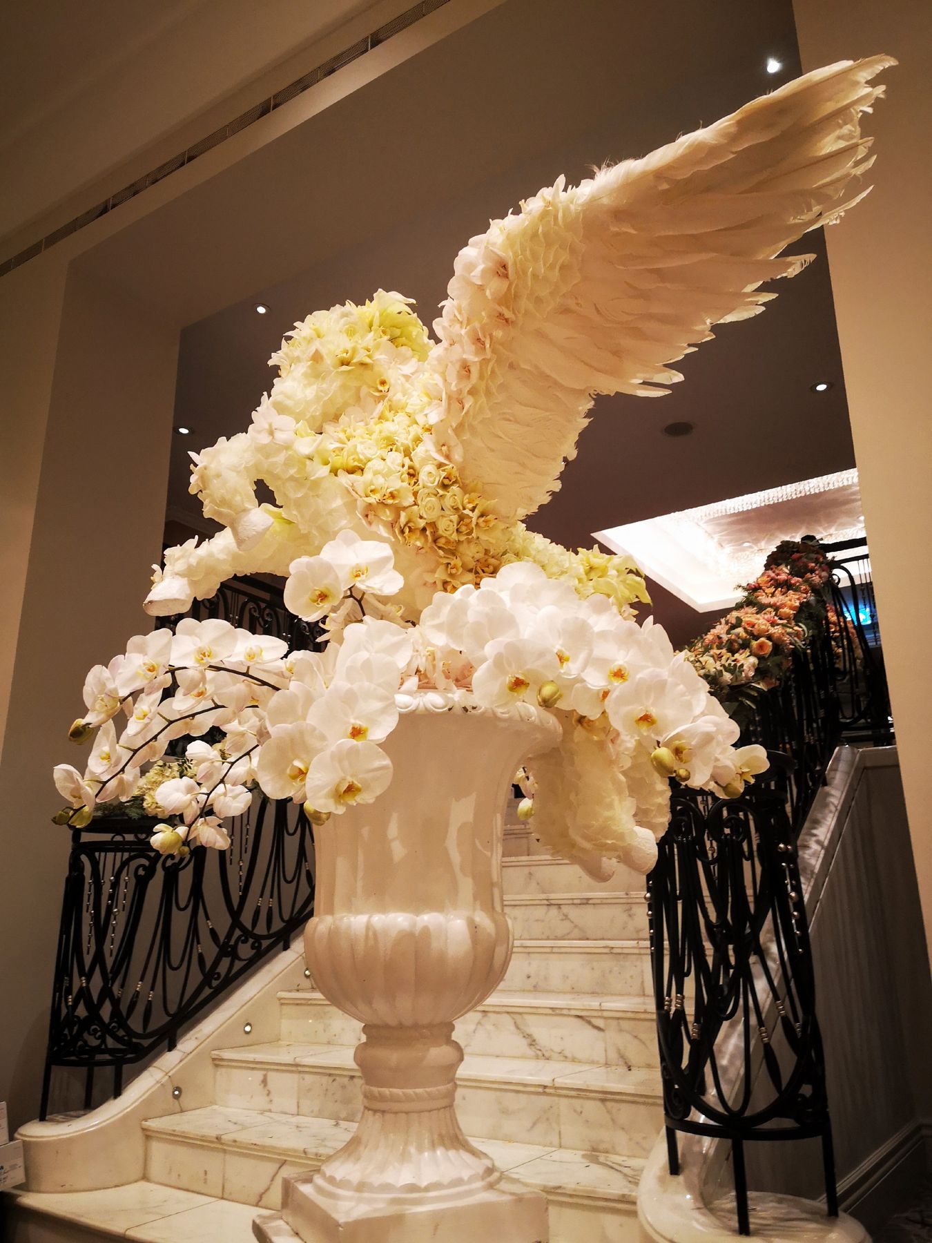 The white Pegasus on its urn at the foot of a marble staircase in London